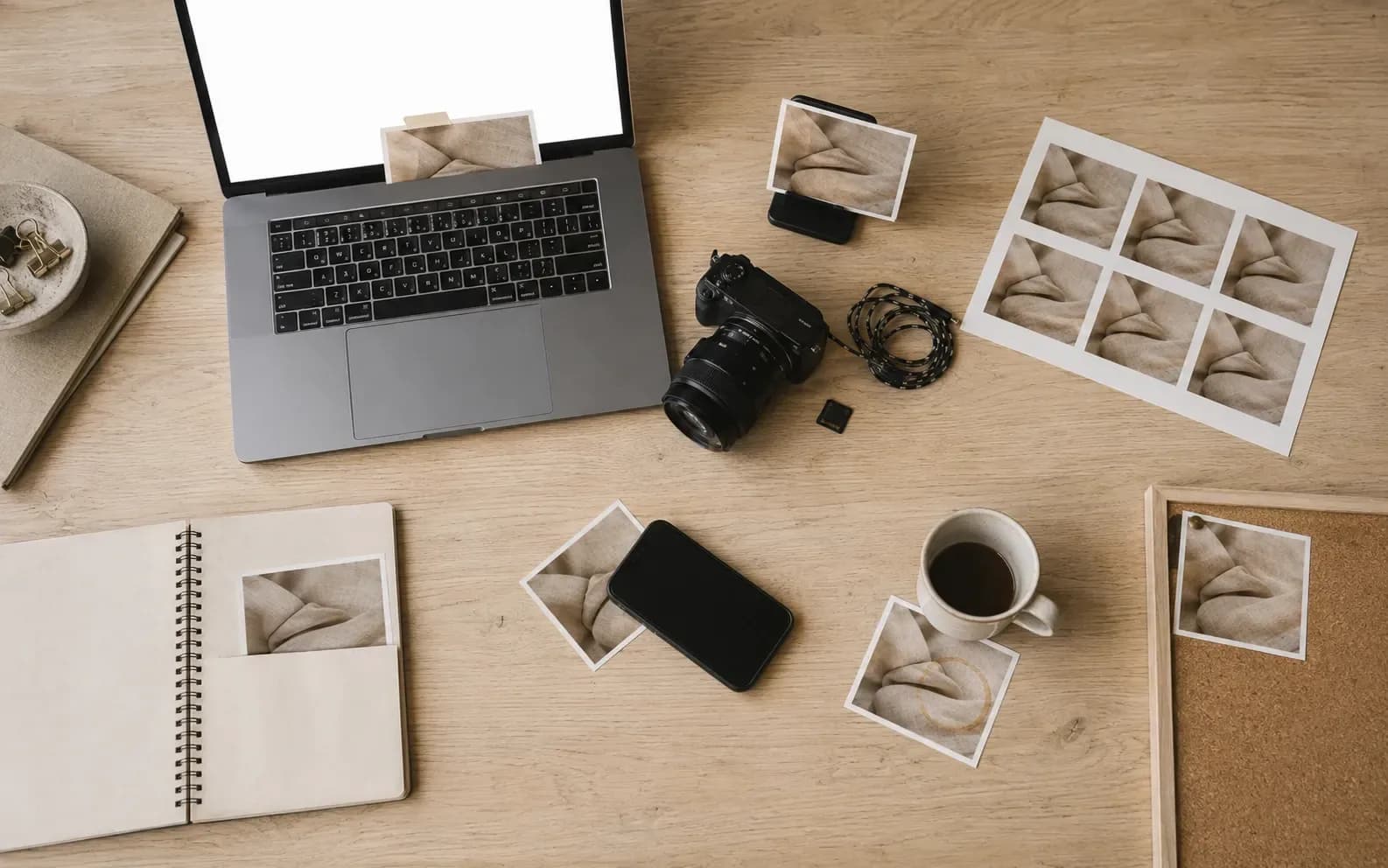 The same photograph appearing seven times across one desk: taped to a laptop, clipped into a phone stand, repeated on a contact sheet, tucked into a notebook, pinned to a board, face down, and under a cup.